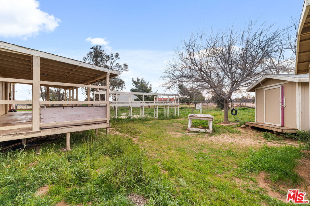 6425 Smoke Tree Road Phelan, CA 92371 - Photo 25 of 35 a view of a chair and table on the wooden deck
