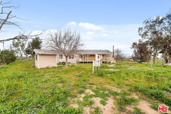 a view of a house with a big yard