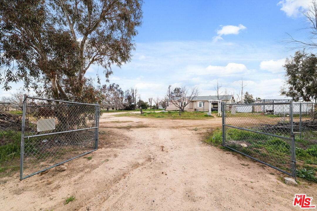 6425 Smoke Tree Road Phelan, CA 92371 - Photo 4 of 35 a view of a yard and a fountain