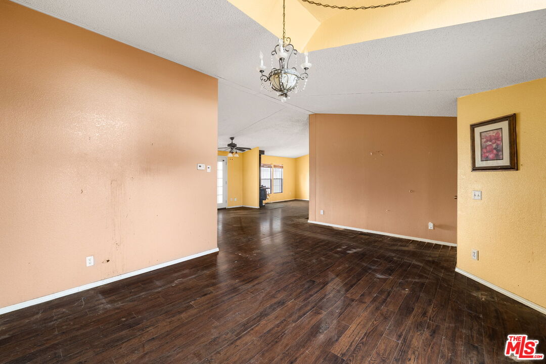 6425 Smoke Tree Road Phelan, CA 92371 - Photo 6 of 35 a view of livingroom with hardwood floor and hallway