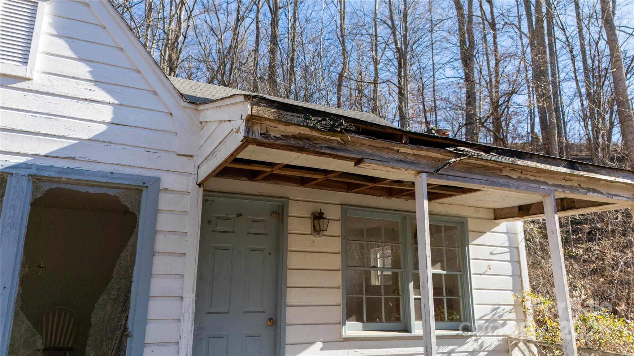 218 Cub Creek Road Bakersville, NC 28705 - Photo 5 of 20 a front view of a house with a door and wooden walls