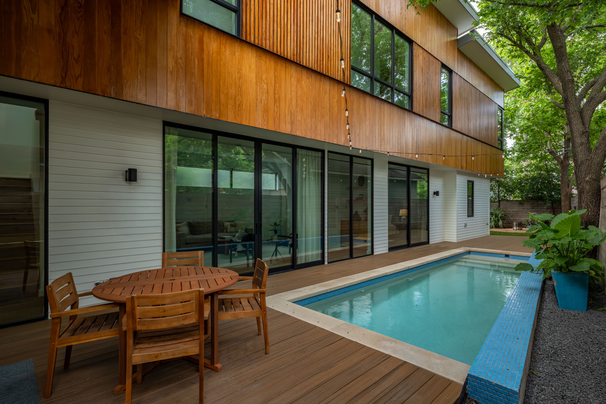 1811 Collier Street Austin, TX 78704 - Photo 1 of 40 Modern exterior featuring wood paneling and white horizontal siding