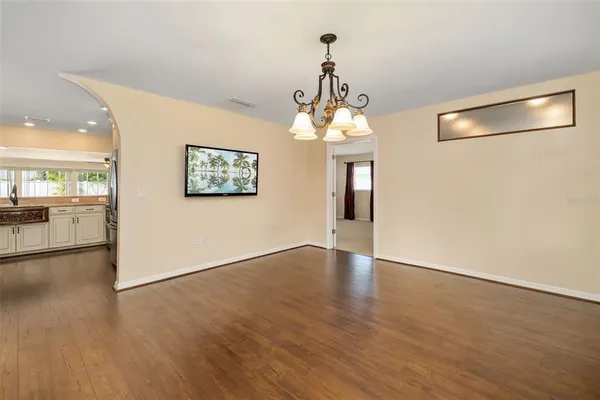 a view of a livingroom with a ceiling fan and window