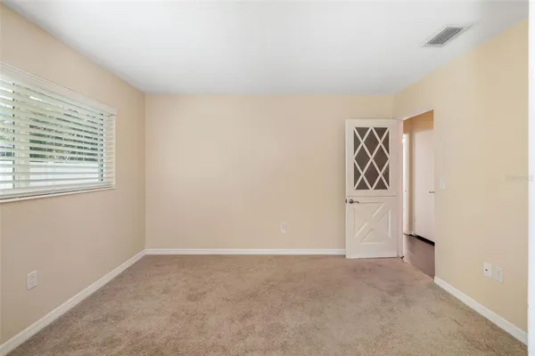a view of a livingroom with a chandelier fan
