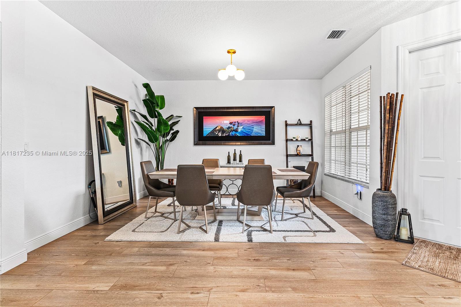 4356 Southwest 179th Way Miramar, FL 33029 - Photo 14 of 65 a view of a dining room with furniture window and wooden floor