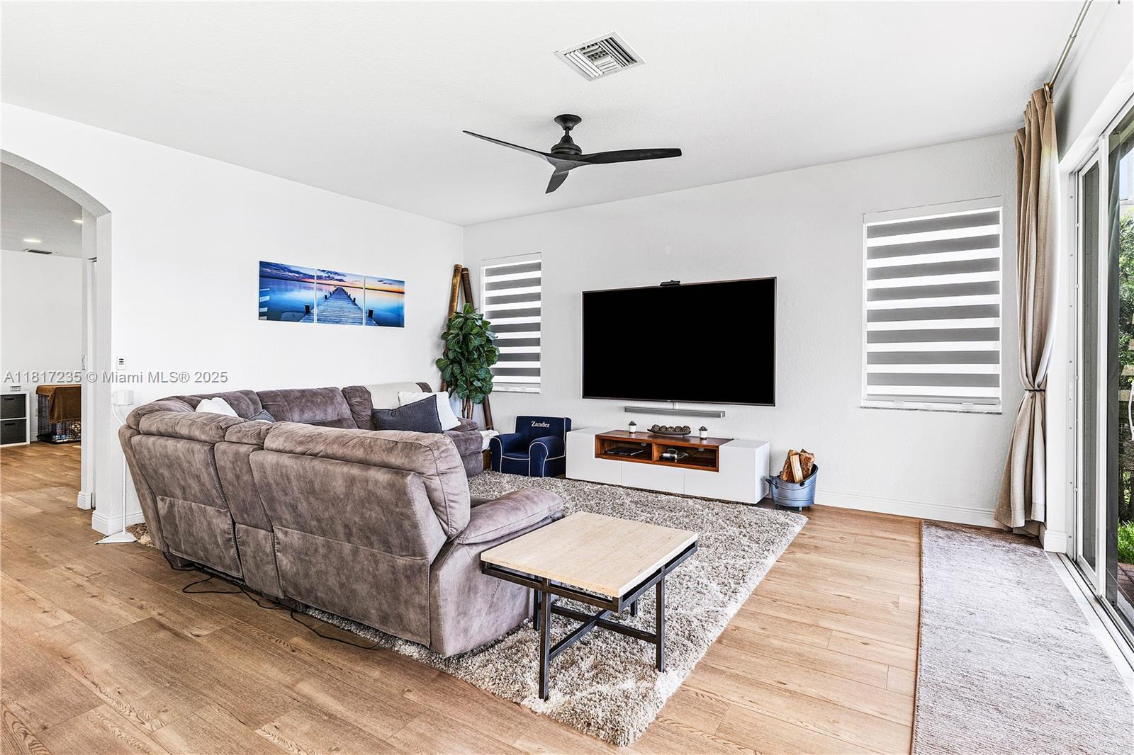 4356 Southwest 179th Way Miramar, FL 33029 - Photo 15 of 65 a living room with furniture and a flat screen tv