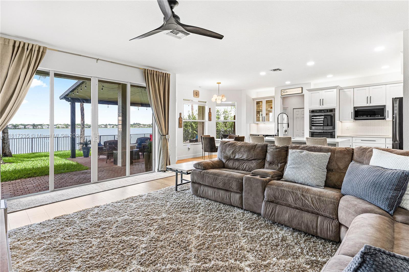 4356 Southwest 179th Way Miramar, FL 33029 - Photo 17 of 65 a living room with furniture and a floor to ceiling window