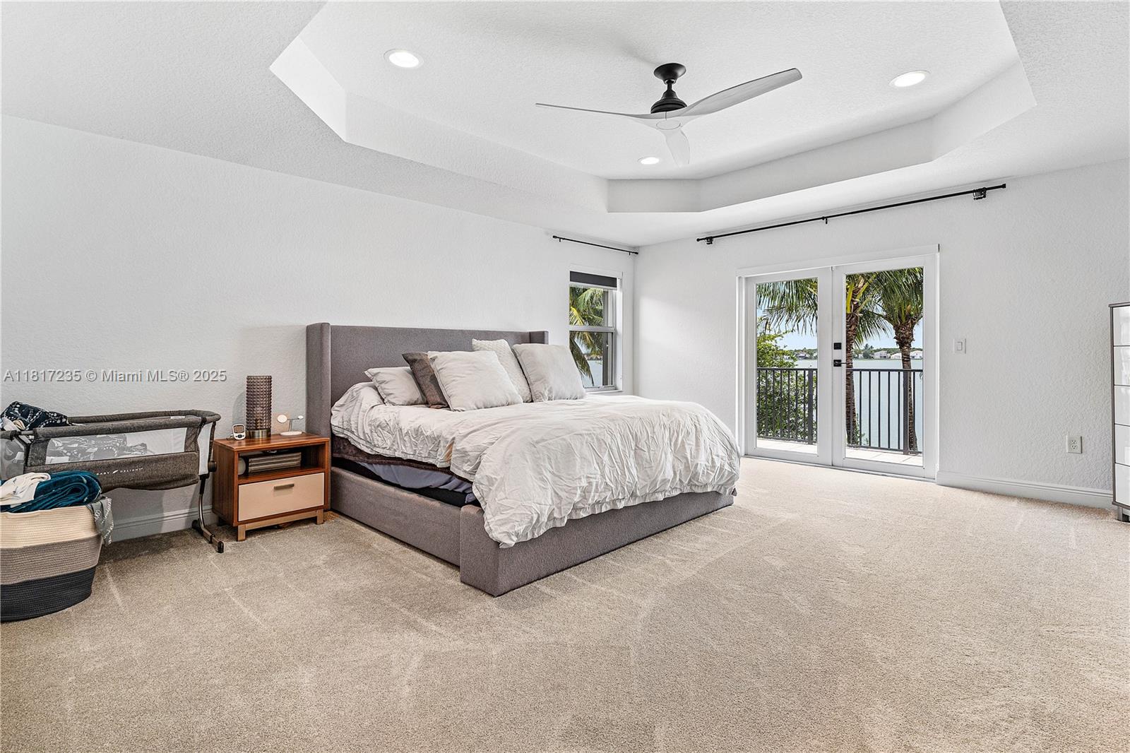 4356 Southwest 179th Way Miramar, FL 33029 - Photo 24 of 65 a spacious bedroom with a bed and a ceiling fan