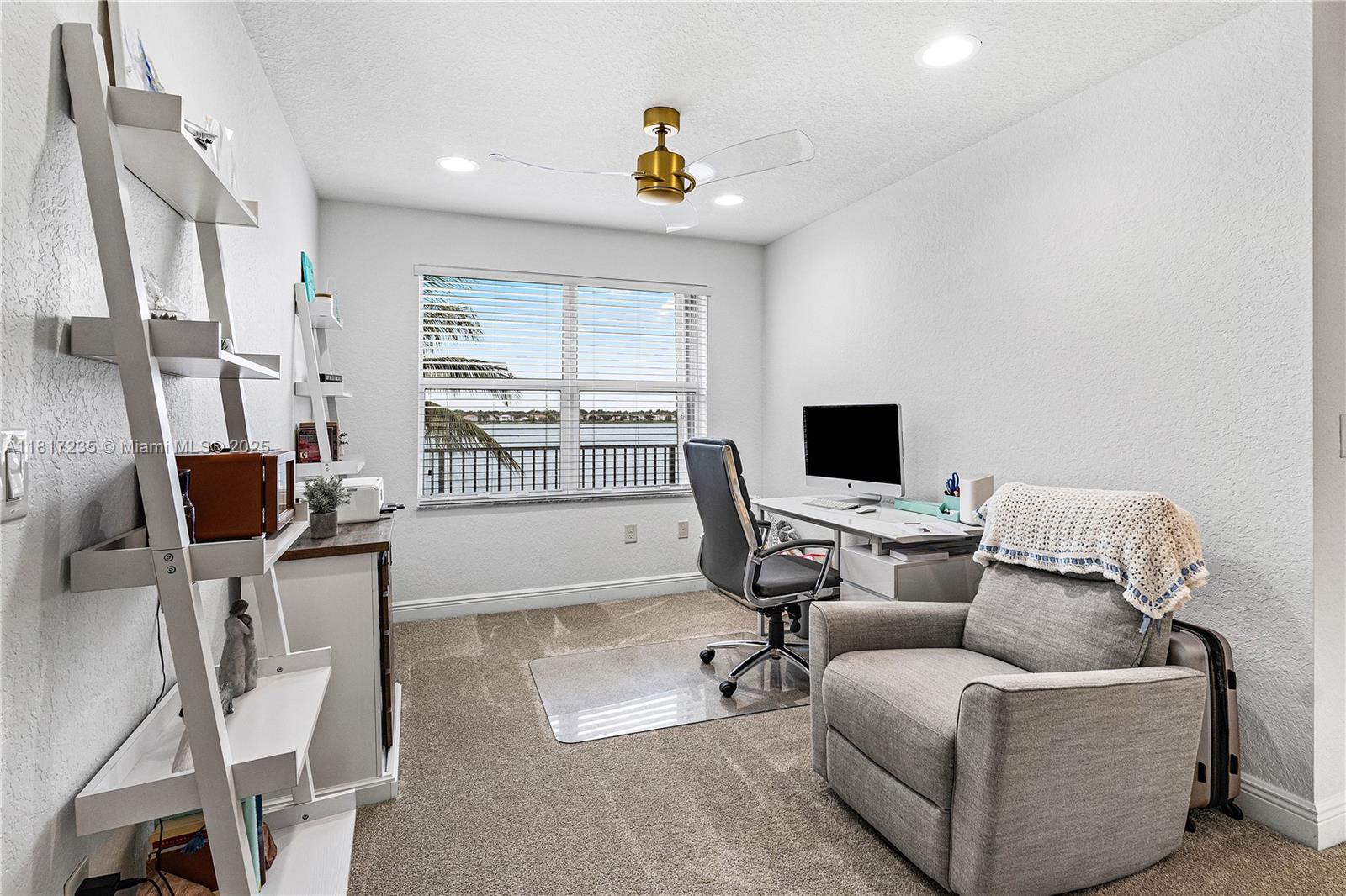 4356 Southwest 179th Way Miramar, FL 33029 - Photo 27 of 65 a living room with furniture and a flat screen tv