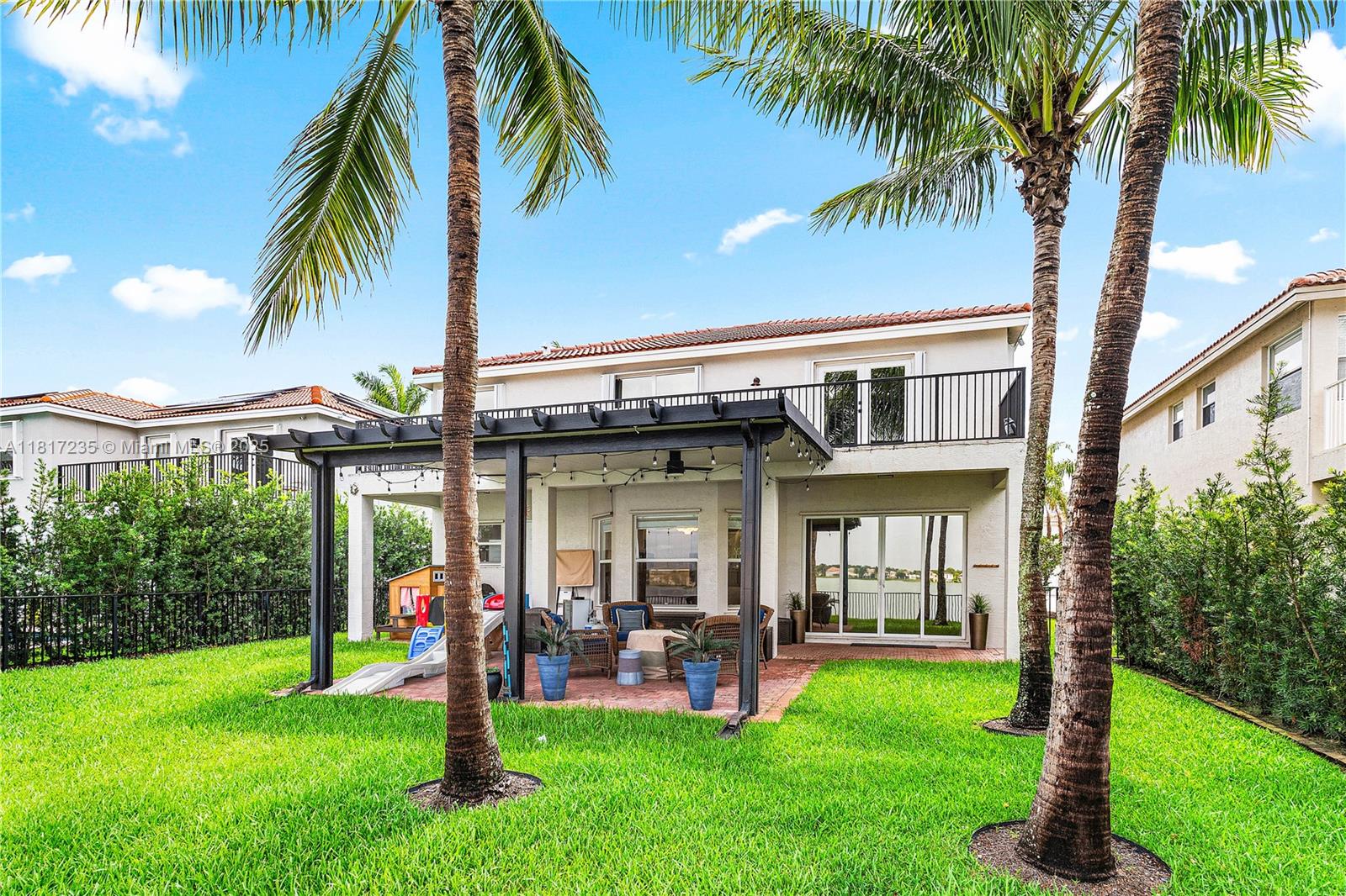 4356 Southwest 179th Way Miramar, FL 33029 - Photo 43 of 65 a view of a house with a yard patio and swimming pool