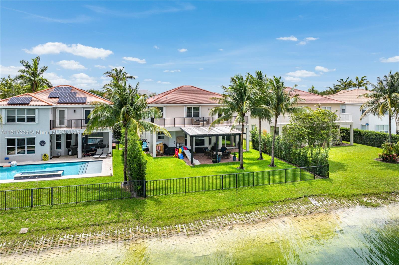 4356 Southwest 179th Way Miramar, FL 33029 - Photo 57 of 65 a view of a house with a big yard and potted plants