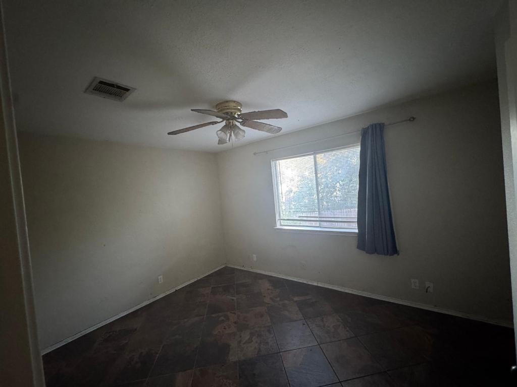 1805 Whirlwind Trail Round Rock, TX 78664 - Photo 13 of 17 Unfurnished room featuring ceiling fan and baseboards