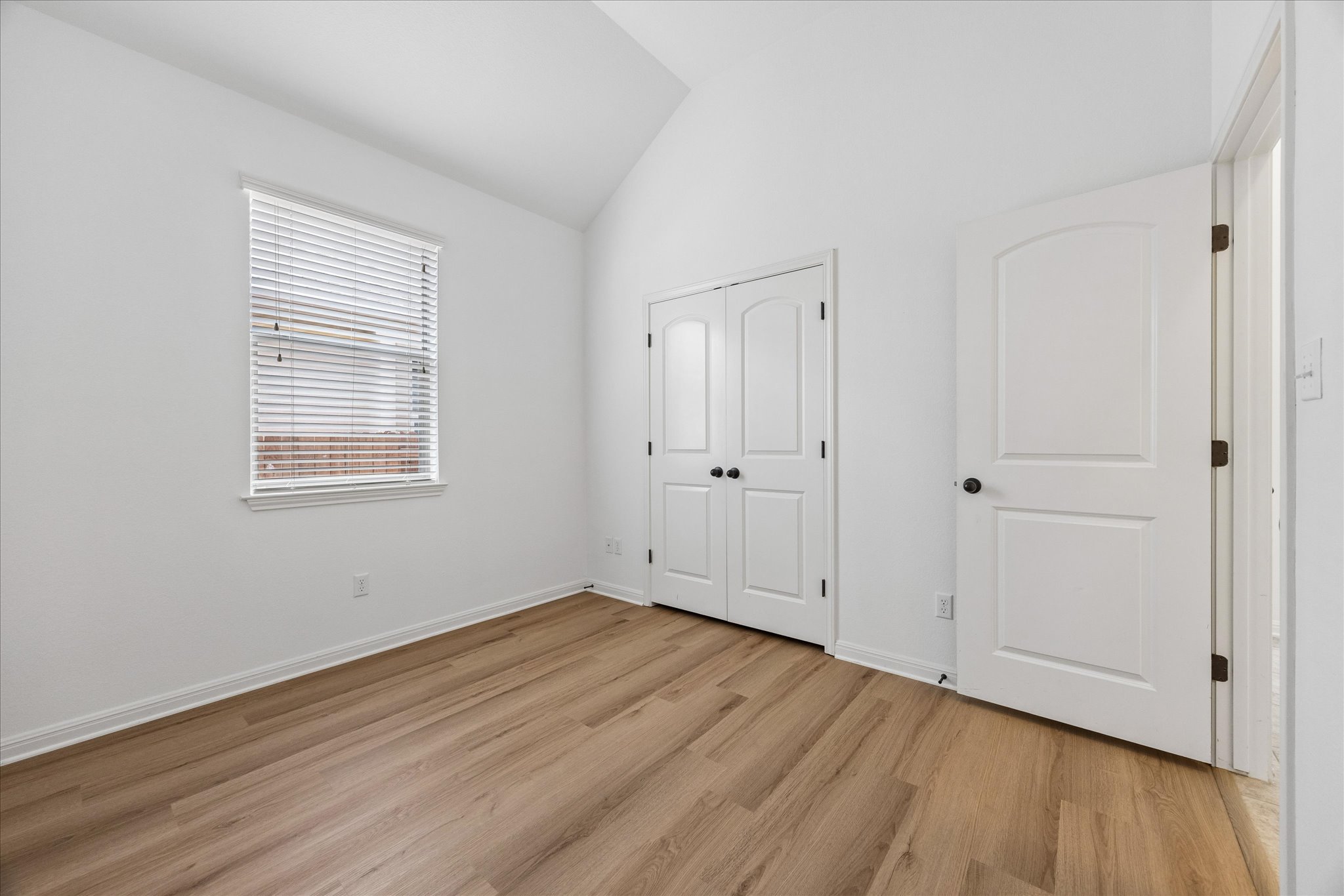 14304 Senia Bend Austin, TX 78738 - Photo 12 of 15 Very nice sized secondary bedroom with new flooring (June 2026)