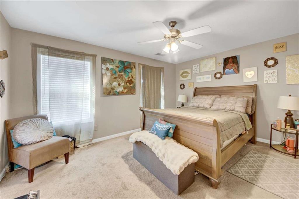 2555 Flat Shoals Road South Fulton, GA 30349 - Photo 17 of 20 a bedroom with a bed couches and window