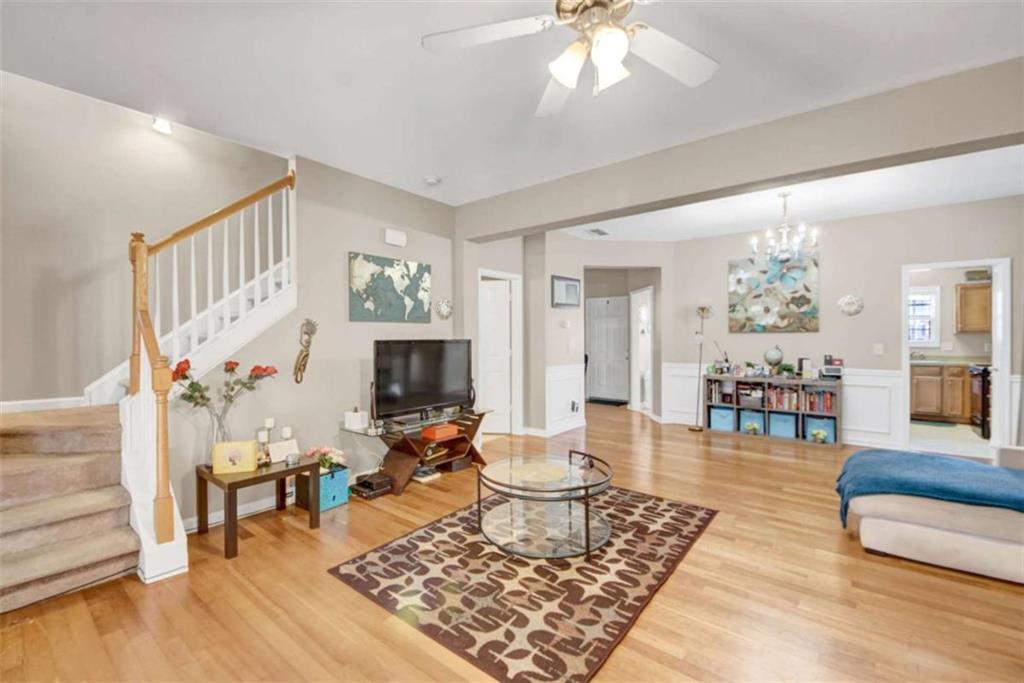 2555 Flat Shoals Road South Fulton, GA 30349 - Photo 6 of 20 a living room with furniture and a flat screen tv