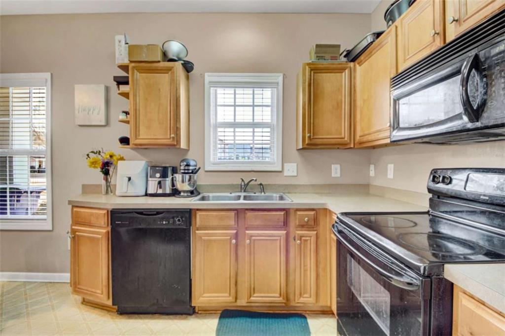 2555 Flat Shoals Road South Fulton, GA 30349 - Photo 8 of 20 a kitchen with cabinets appliances and a sink