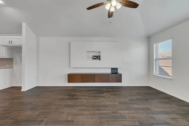 a kitchen with granite countertop a sink and stainless steel appliances