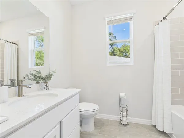 a utility room with cabinets washer and dryer