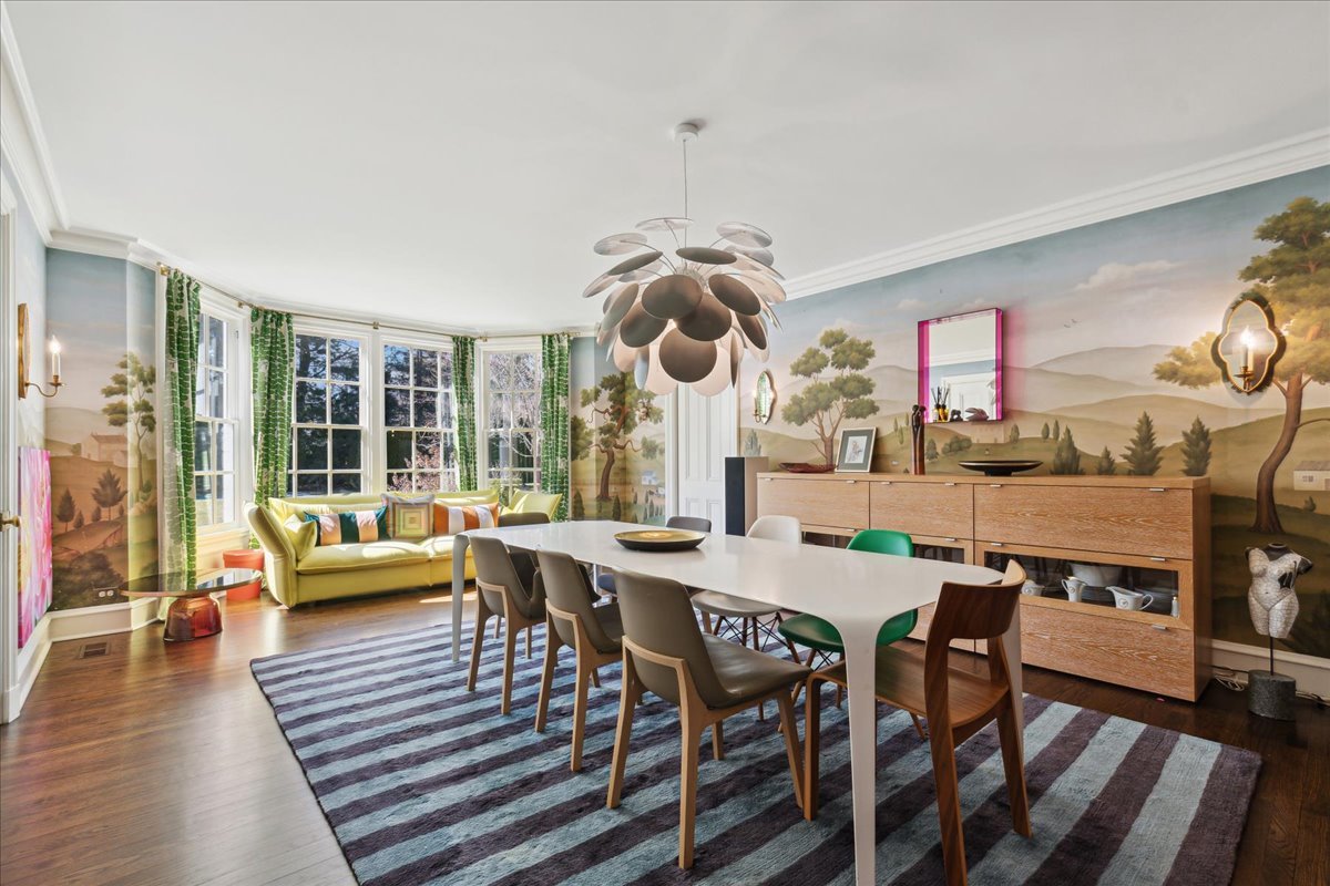 1320 Elm Tree Road Lake Forest, IL 60045 - Photo 16 of 52 a dining room with wooden floor a chandelier a glass table and chairs