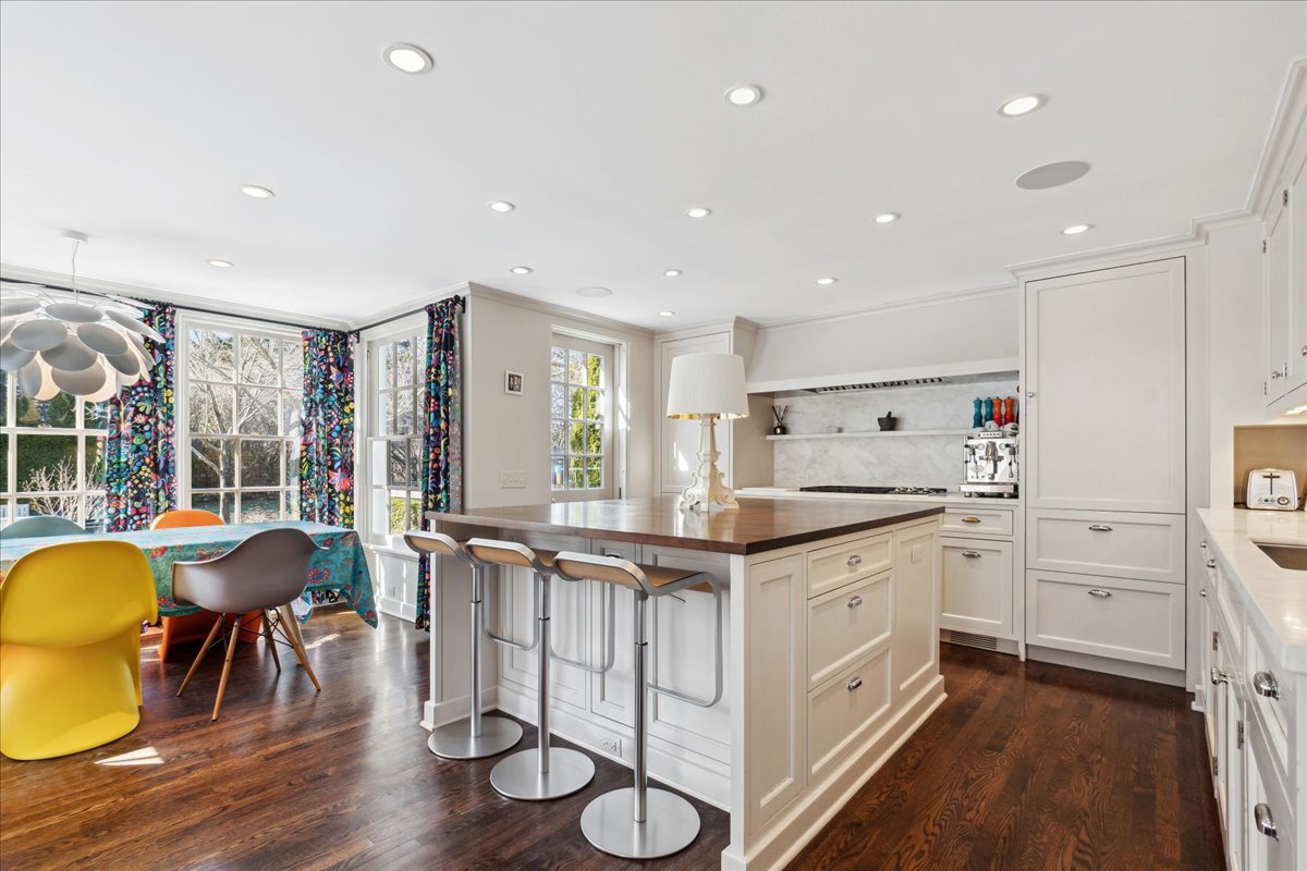 1320 Elm Tree Road Lake Forest, IL 60045 - Photo 20 of 52 a kitchen with stainless steel appliances granite countertop a stove a sink dishwasher and a dining table with wooden floor
