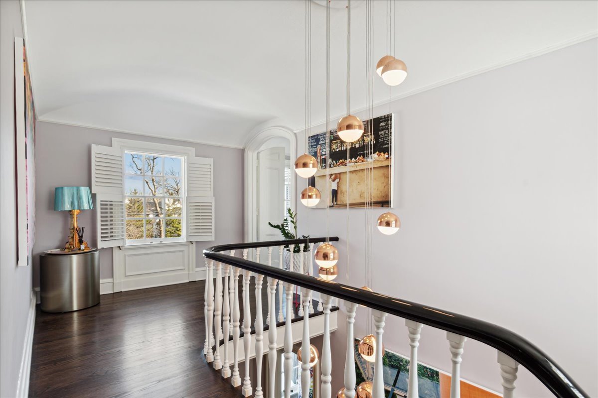 1320 Elm Tree Road Lake Forest, IL 60045 - Photo 26 of 52 a view of staircase and kitchen with wooden floor
