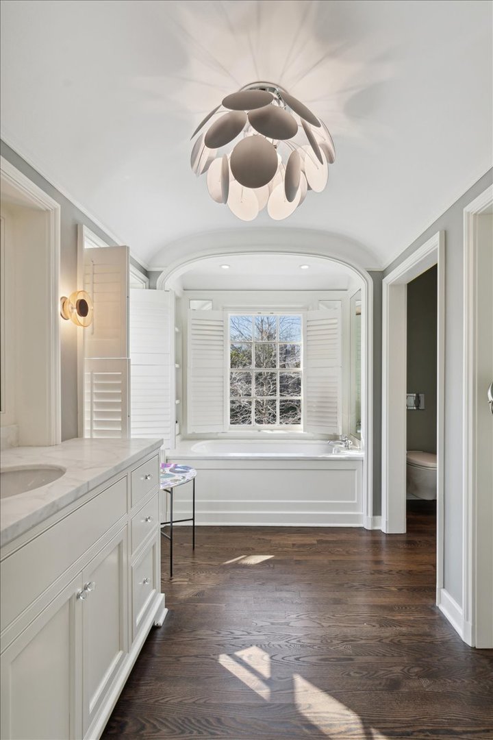 1320 Elm Tree Road Lake Forest, IL 60045 - Photo 32 of 52 a view of an empty room with a window and wooden floor