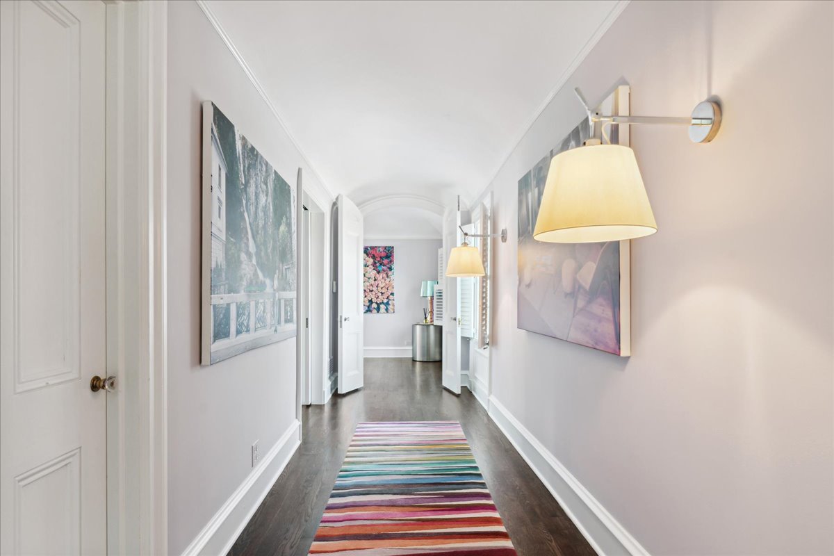 1320 Elm Tree Road Lake Forest, IL 60045 - Photo 36 of 52 a view of a hallway with wooden floor and a bathroom