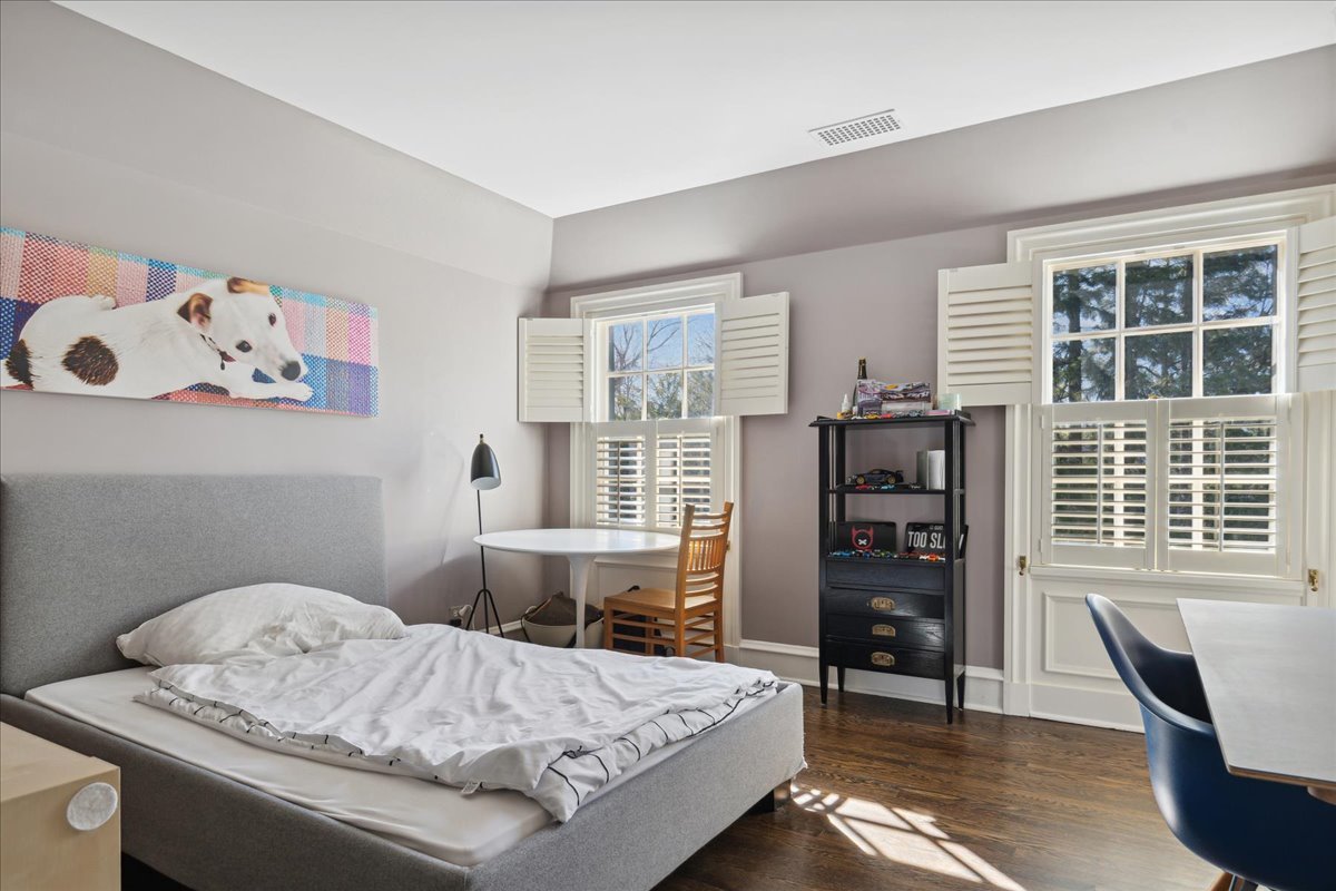 1320 Elm Tree Road Lake Forest, IL 60045 - Photo 40 of 52 a bedroom with a bed and wooden floor