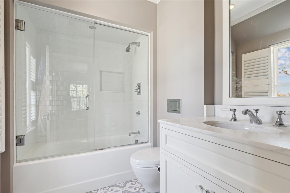 1320 Elm Tree Road Lake Forest, IL 60045 - Photo 43 of 52 a bathroom with a sink a toilet and a large mirror