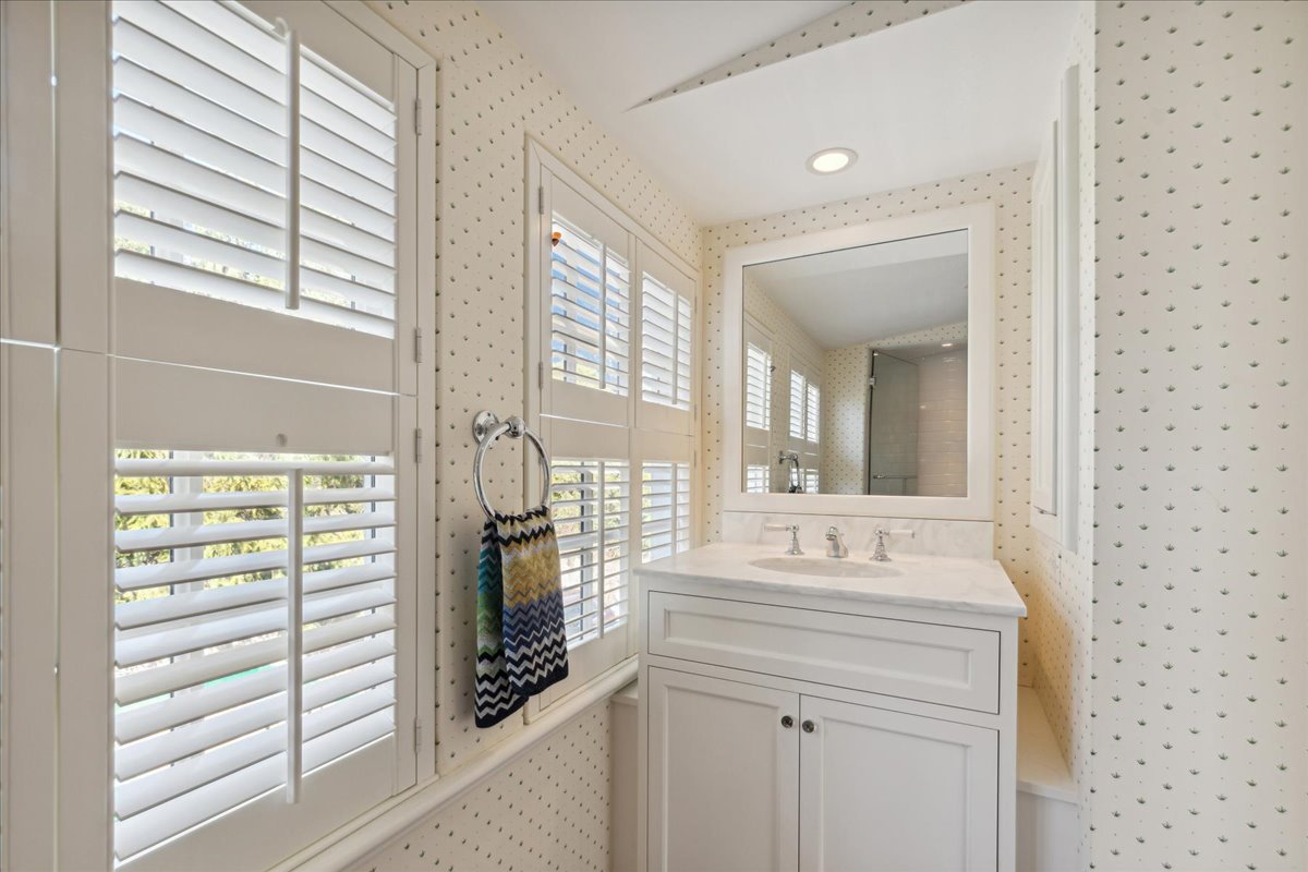 1320 Elm Tree Road Lake Forest, IL 60045 - Photo 47 of 52 a bathroom with a sink a vanity and a mirror
