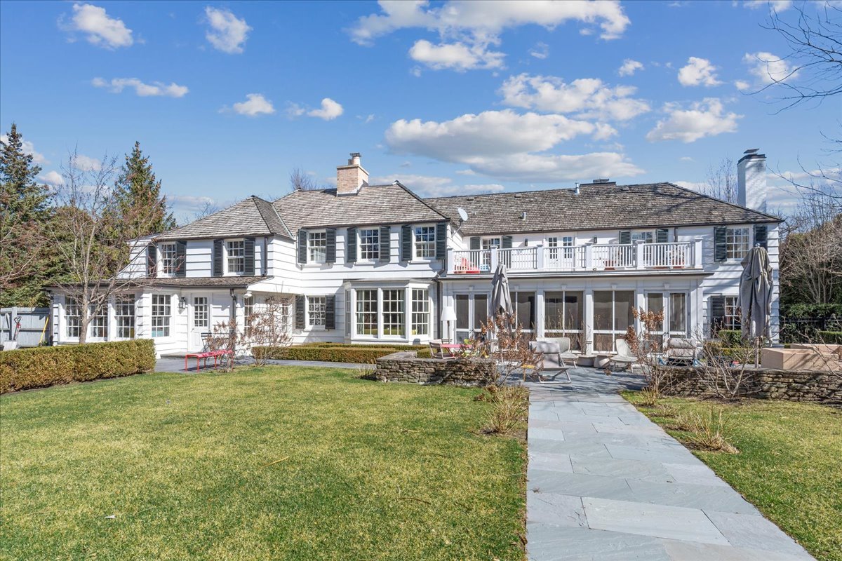 1320 Elm Tree Road Lake Forest, IL 60045 - Photo 51 of 52 a front view of a house with a garden and trees