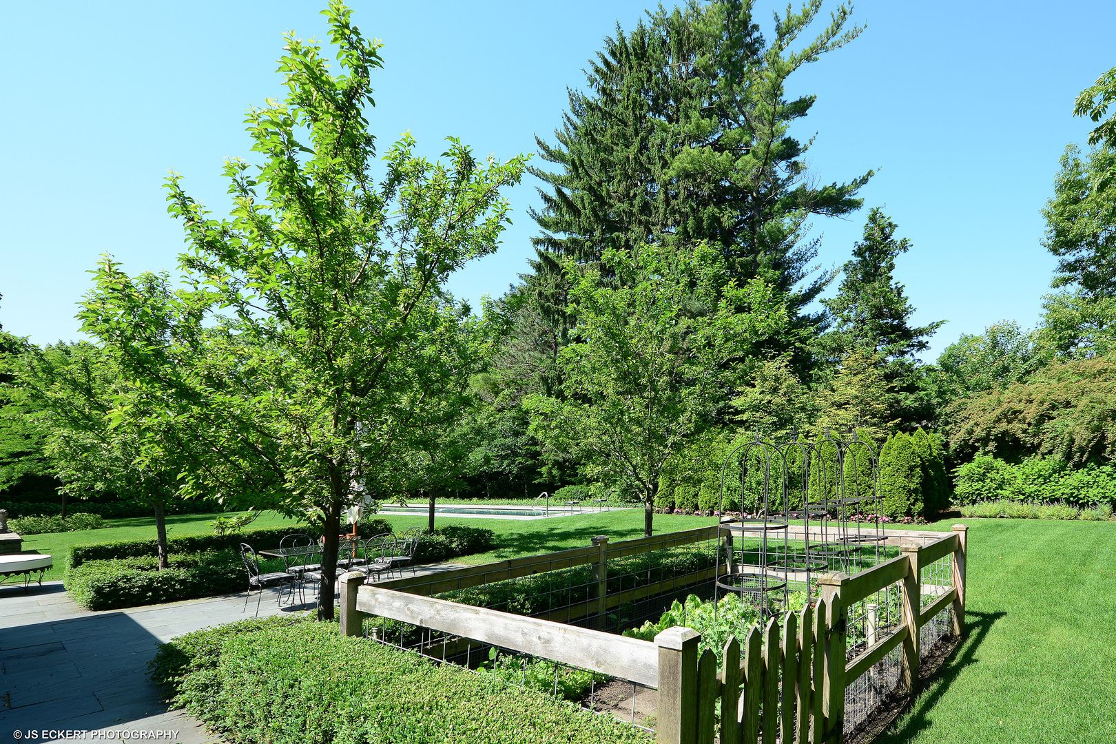 1320 Elm Tree Road Lake Forest, IL 60045 - Photo 8 of 52 a view of a garden with wooden fence