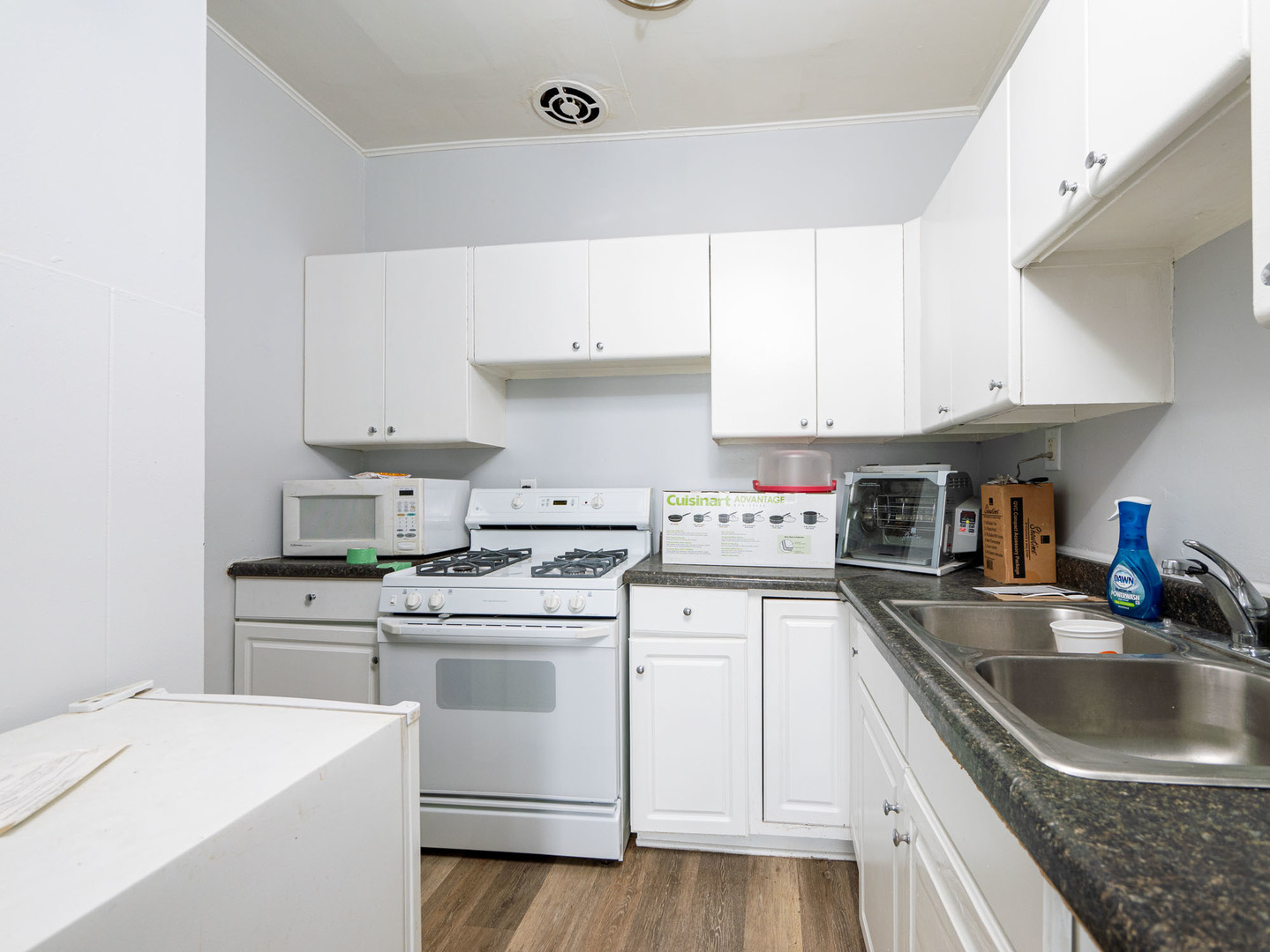 4039 147th Street Midlothian, IL 60445 - Photo 18 of 36 a kitchen with a sink a stove and cabinets