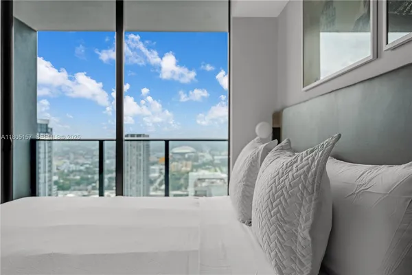 a view of a balcony with a floor to ceiling window