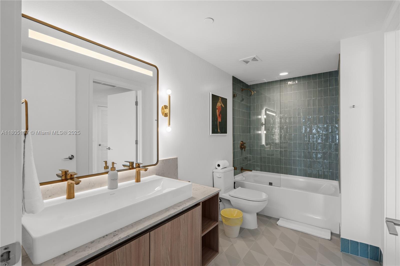 601 Northeast 1st, Unit 4204 Miami, FL 33132 - Photo 16 of 25 a bathroom with a sink a toilet and shower