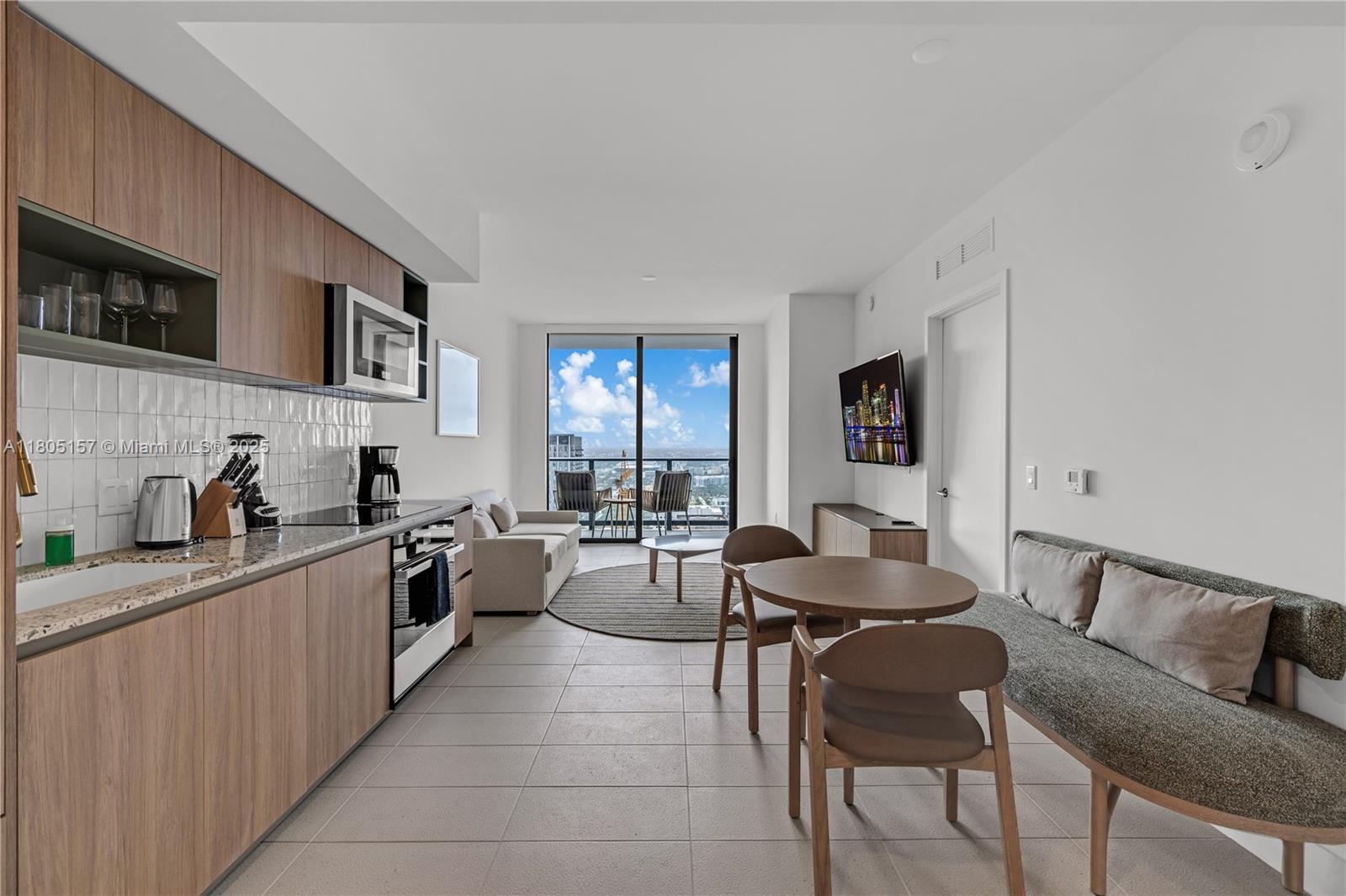 601 Northeast 1st, Unit 4204 Miami, FL 33132 - Photo 2 of 25 a living room with furniture and a window