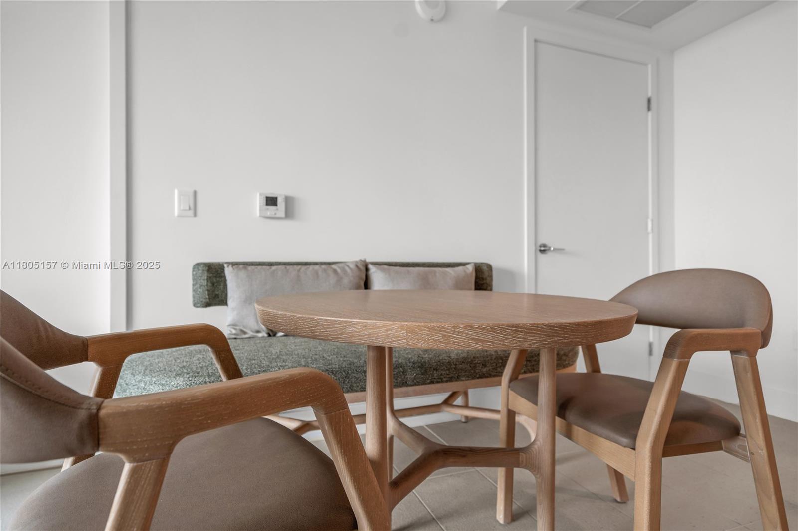 601 Northeast 1st, Unit 4204 Miami, FL 33132 - Photo 9 of 25 a view of a dining room with furniture and wooden floor