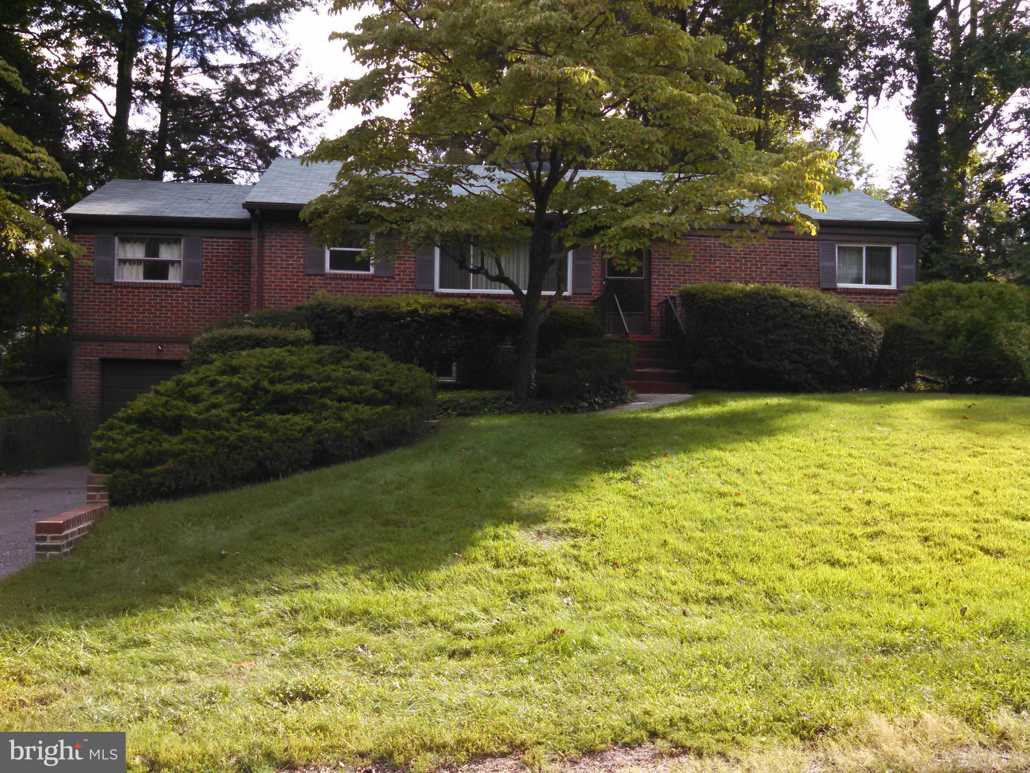 2007 Pagebrook Road Silver Spring, MD 20903 - Photo 1 of 24 a front view of a house with garden