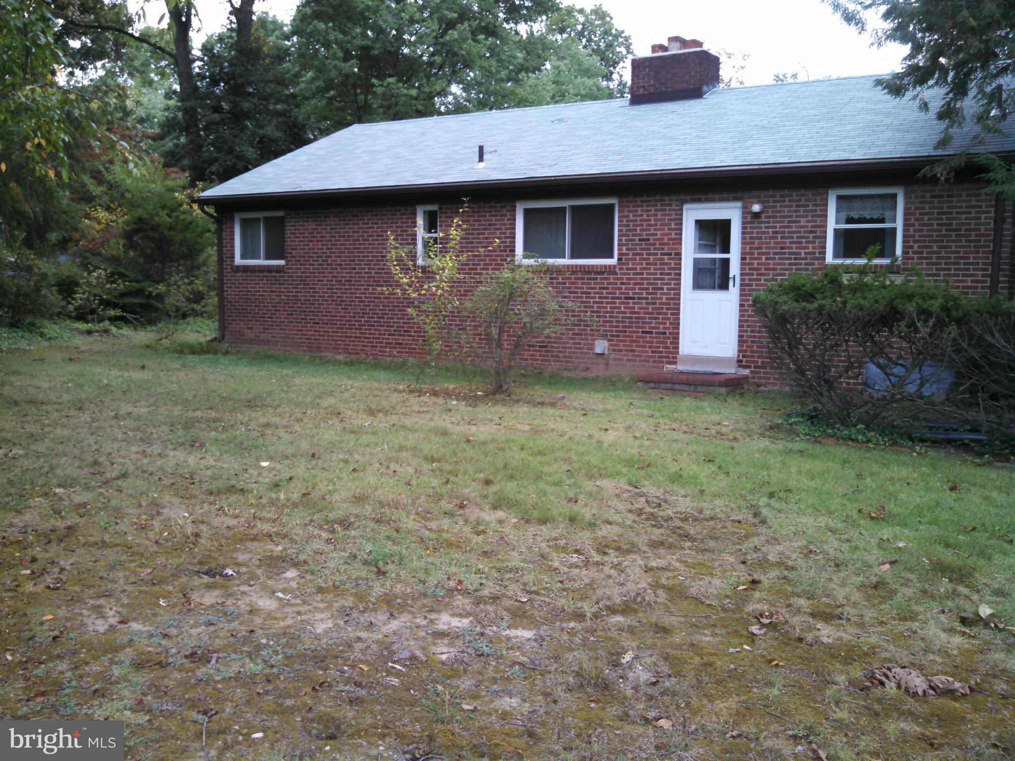 2007 Pagebrook Road Silver Spring, MD 20903 - Photo 23 of 24 a brick house with yard and trees