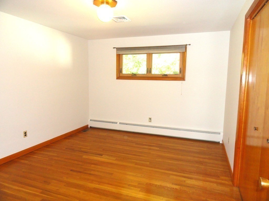 88 Charlton Road Dudley, MA 01571 - Photo 23 of 40 an empty room with a window