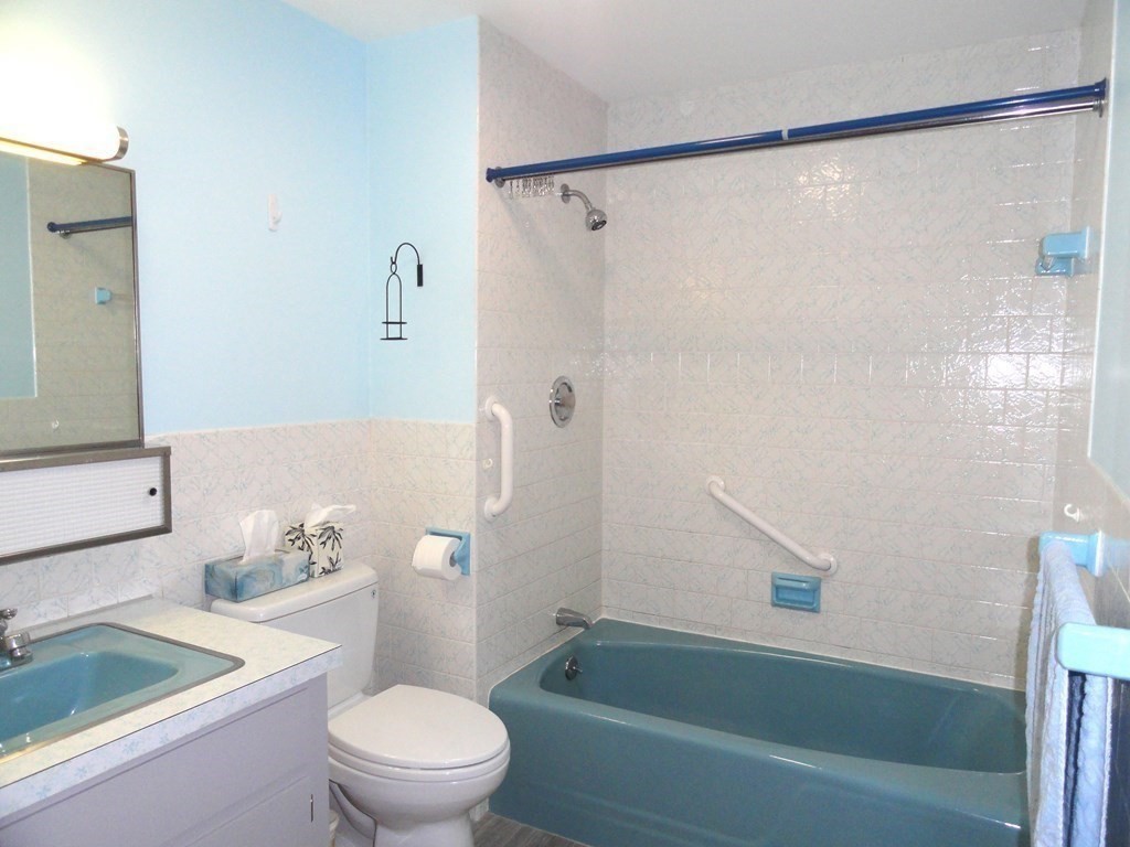 88 Charlton Road Dudley, MA 01571 - Photo 24 of 40 a bathroom with a sink a toilet and a bathtub