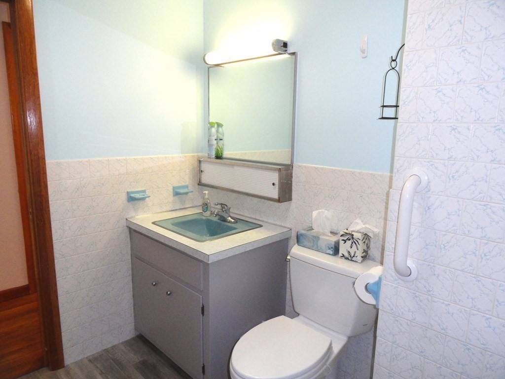 88 Charlton Road Dudley, MA 01571 - Photo 25 of 40 a bathroom with a sink toilet and mirror