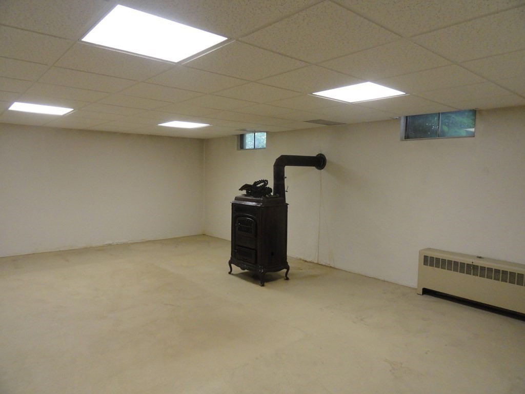 88 Charlton Road Dudley, MA 01571 - Photo 30 of 40 a view of a room with gym equipment