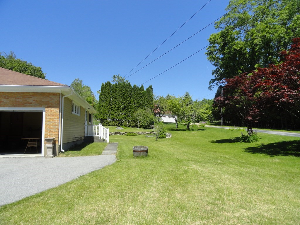 88 Charlton Road Dudley, MA 01571 - Photo 35 of 40 a view of a house with backyard and a tree