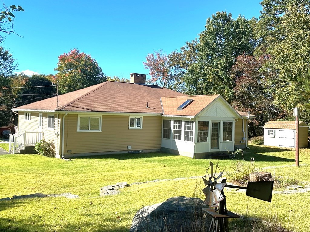 88 Charlton Road Dudley, MA 01571 - Photo 36 of 40 a front view of a house with swimming pool having outdoor seating