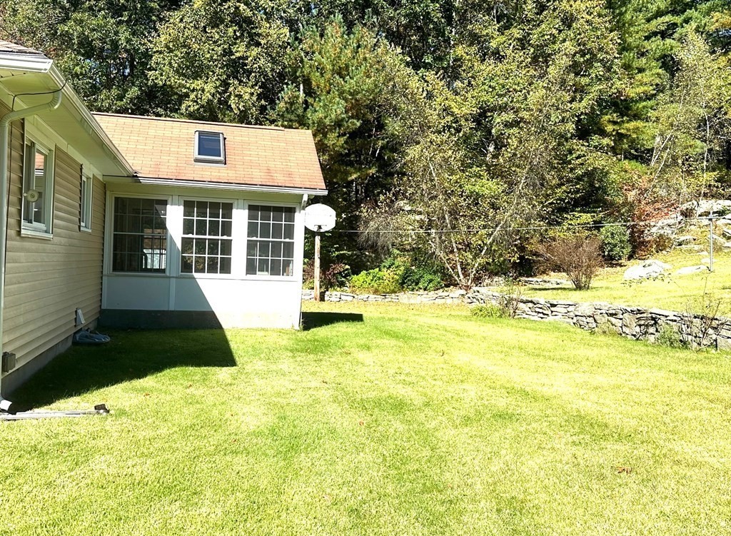88 Charlton Road Dudley, MA 01571 - Photo 38 of 40 a front view of a house with a yard