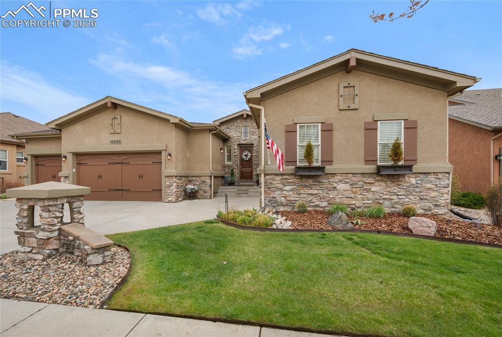 13320 Clinet Drive Colorado Springs, CO 80921 - Photo 2 of 50 a front view of a house with a yard