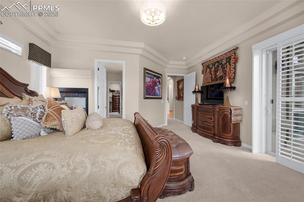 13320 Clinet Drive Colorado Springs, CO 80921 - Photo 21 of 50 a bedroom with furniture a flat tv screen and a dresser