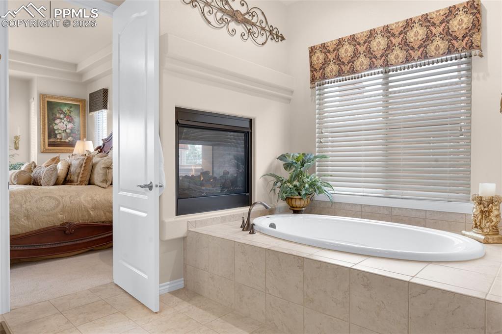 13320 Clinet Drive Colorado Springs, CO 80921 - Photo 23 of 50 a bathroom with a bathtub and a sink