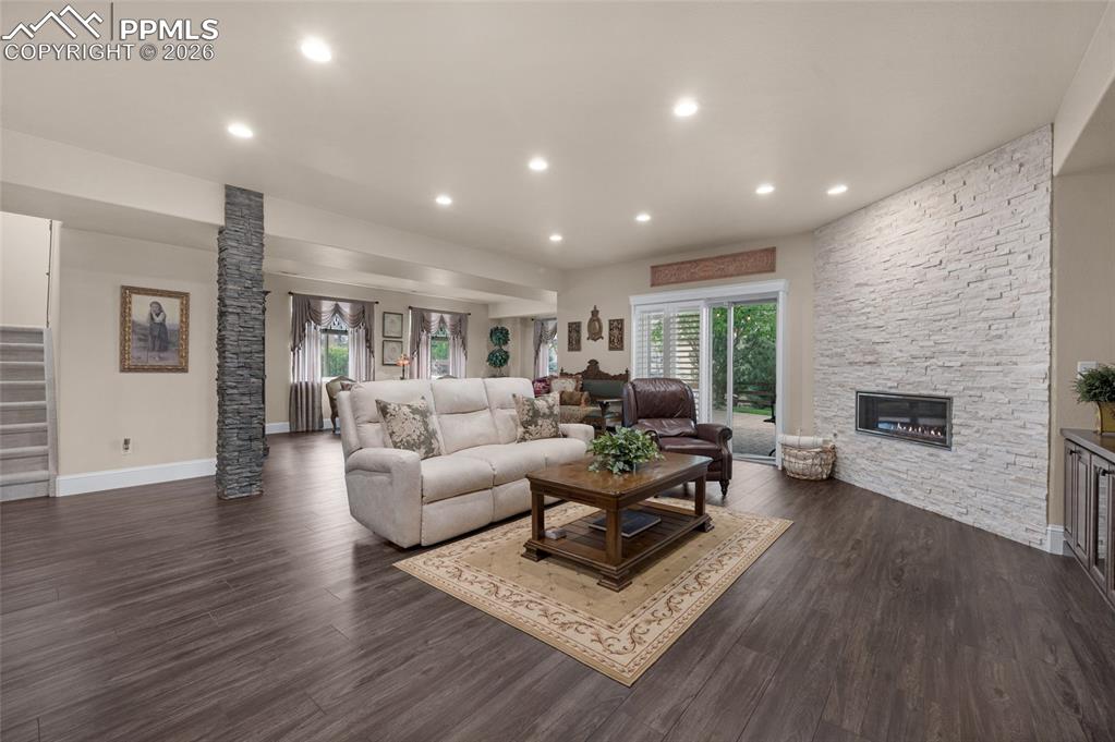13320 Clinet Drive Colorado Springs, CO 80921 - Photo 27 of 50 a living room with furniture and a fireplace